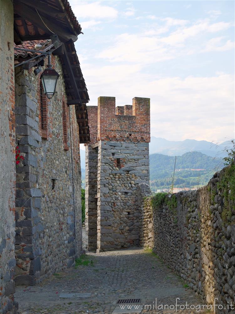 Candelo (Biella, Italy) - Square tower of the ricetto with the Biella Prealps in the background